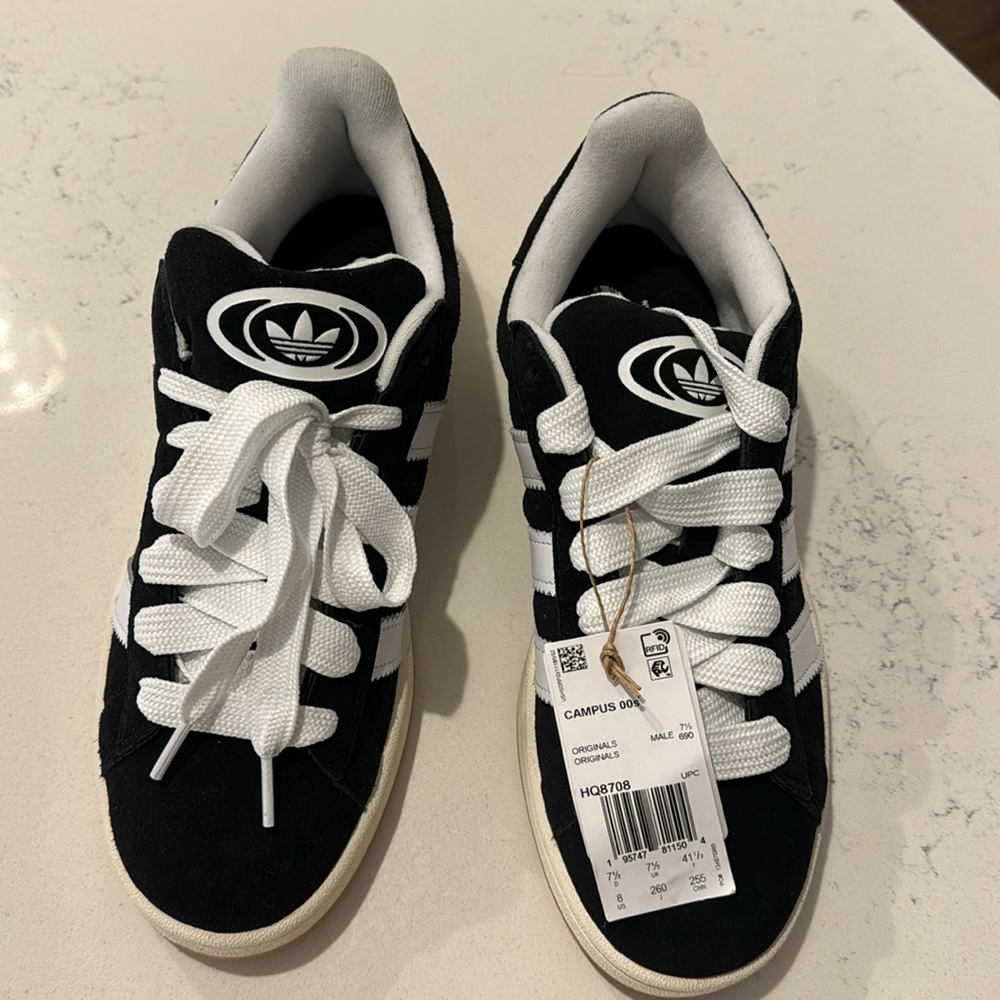 Adidas campus men’s size 8. Black with white stripes. Brand new with tags.